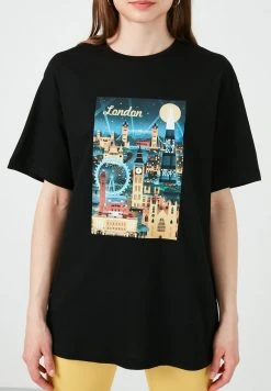 LELA Camiseta Estampada - Black, Mujer -LELA Ventas 2024 2c750ea3f7c842b6938208fa28c6d3bd