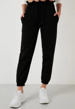 LELA Pantalones Deportivos - Black, Mujer